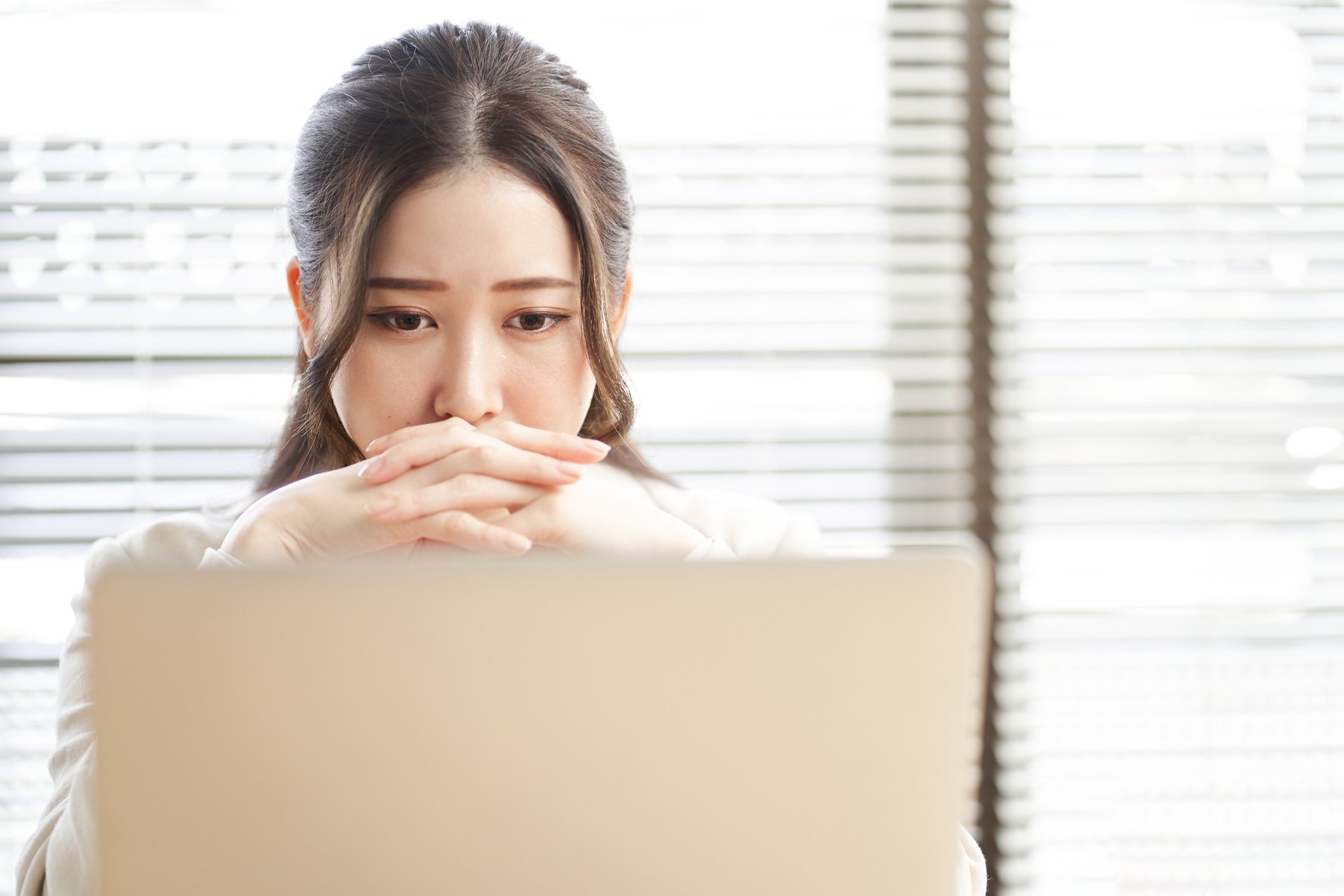 Asian woman thinking in trouble